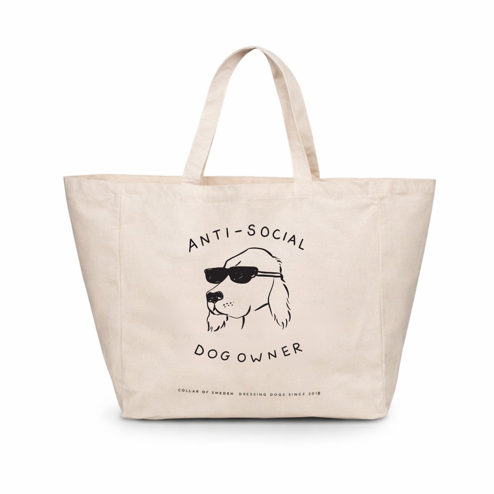 Beige large tote bag with a dog illustration and the text Anti-Social Dog Owner on a white background